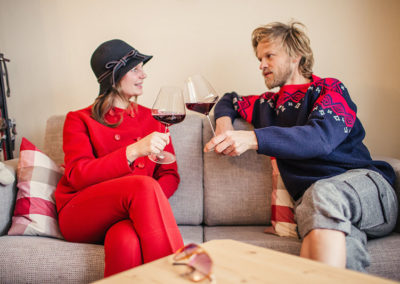 Couple on the sofa drinking wine