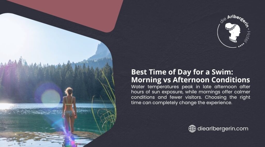 Woman wading into a calm alpine lake in morning light, comparing best swim times as water temperatures peak in late afternoon.