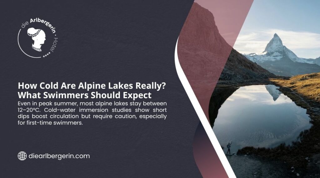 Person standing beside a cold alpine lake with mountain reflection, where water stays 12–20°C even in peak summer for swimmers.