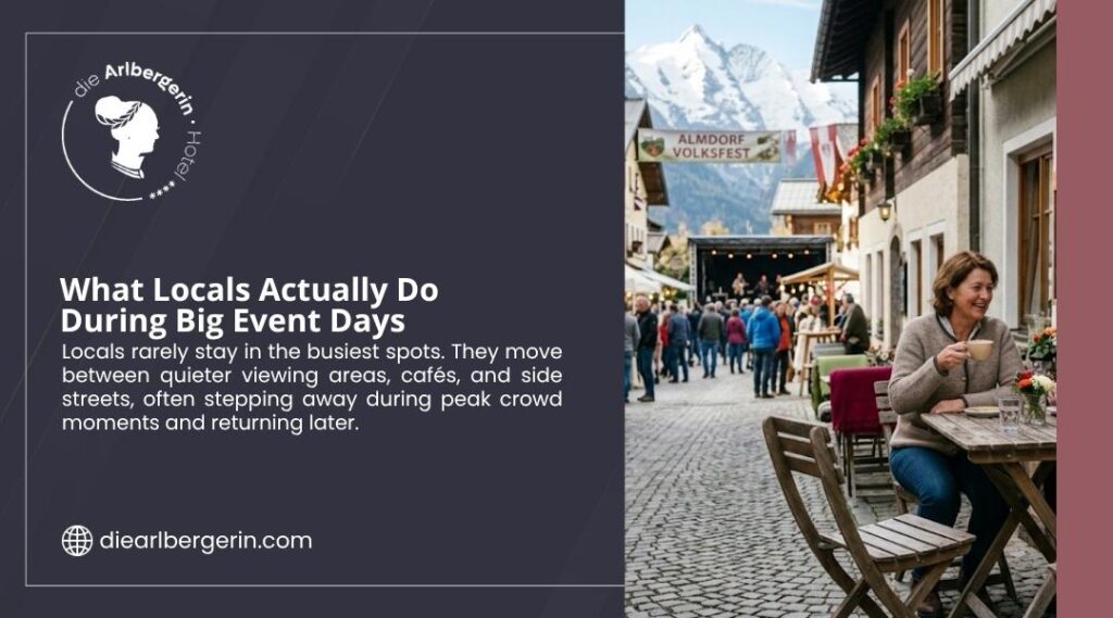 Woman sitting at an outdoor café table on a busy event street in St. Anton, smiling with a coffee cup during a festival day.
