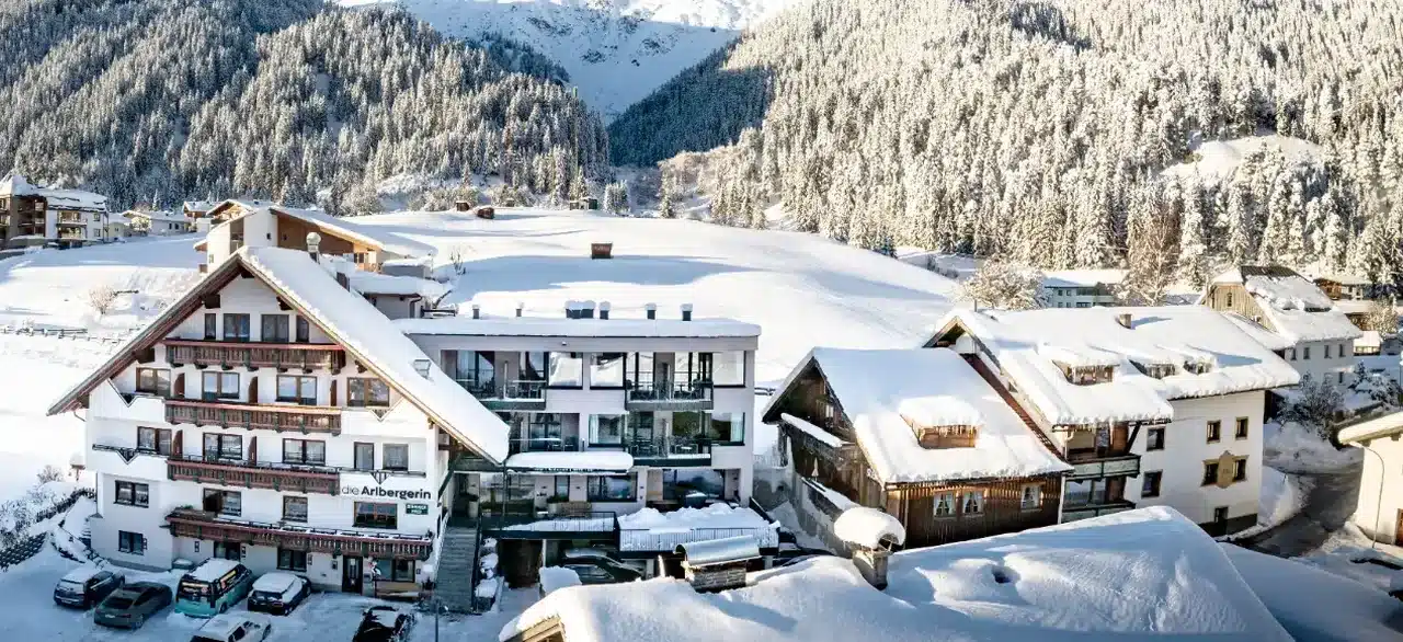 Aerial winter view of Hotel Die Arlbergerin and Pension Der Steinbock in St Anton am Arlberg