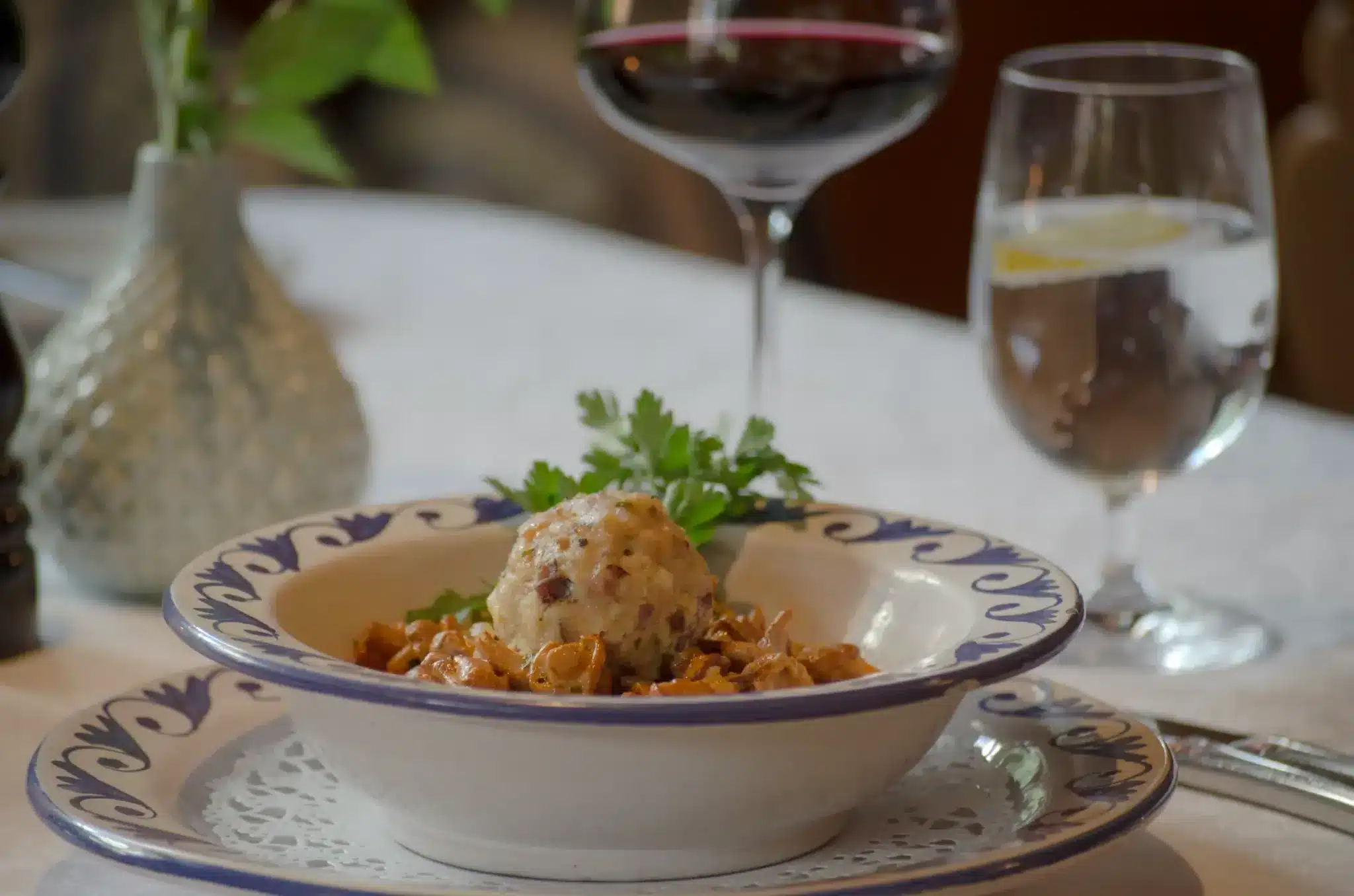 Startseite 68 Tyrolean dumpling dish served with red wine